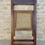 Wooden folding chair with caned seat