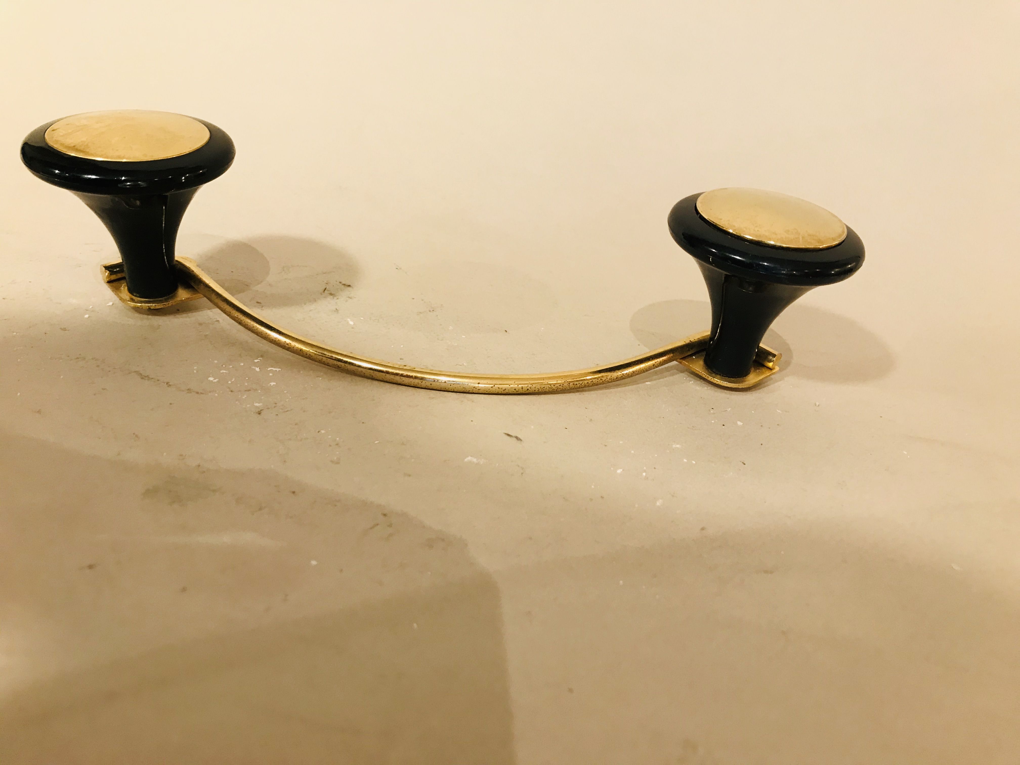 Gold and black metal coatrack 1960