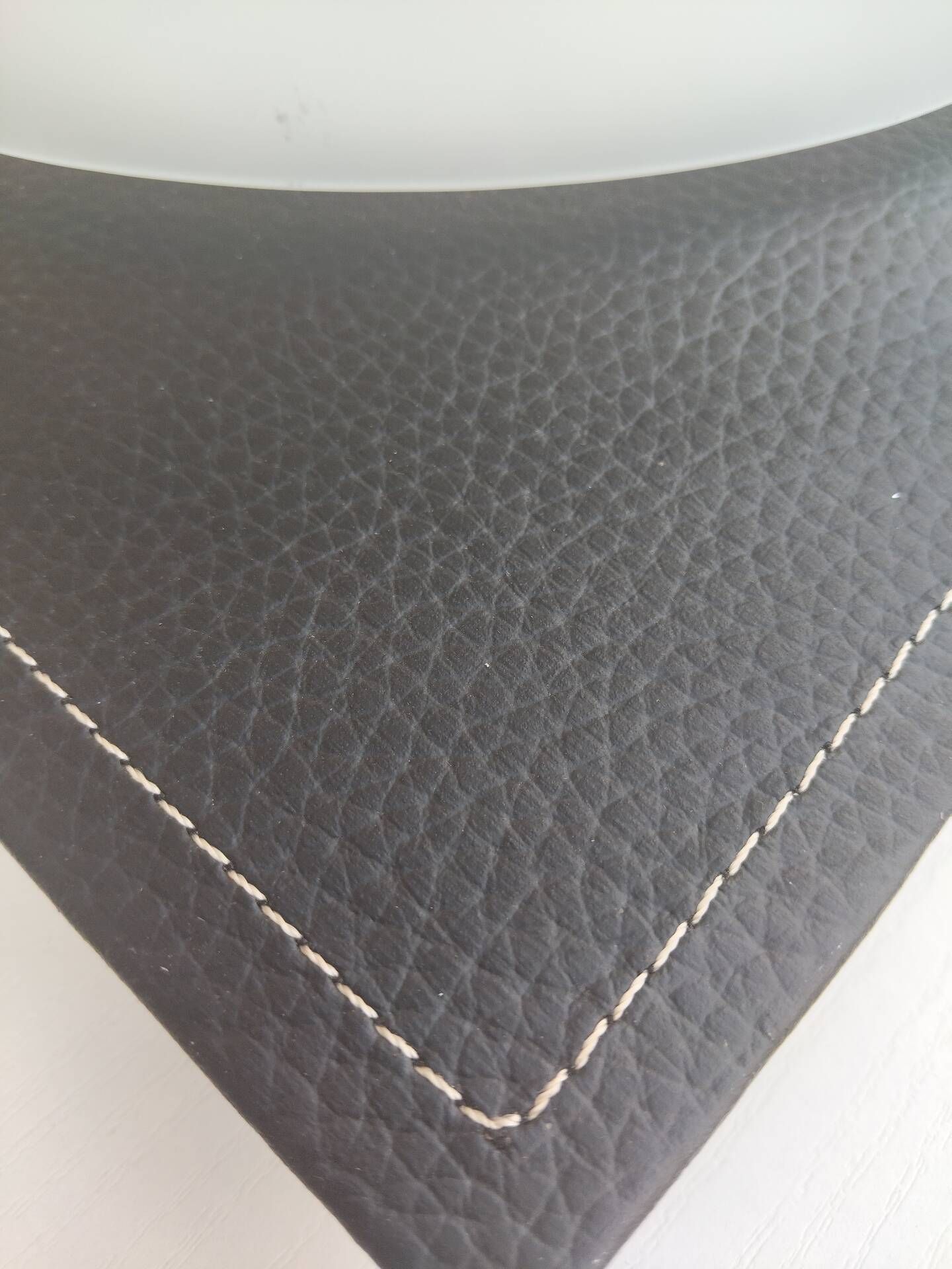 Wall light or ceiling light in frosted glass and leather-like material.