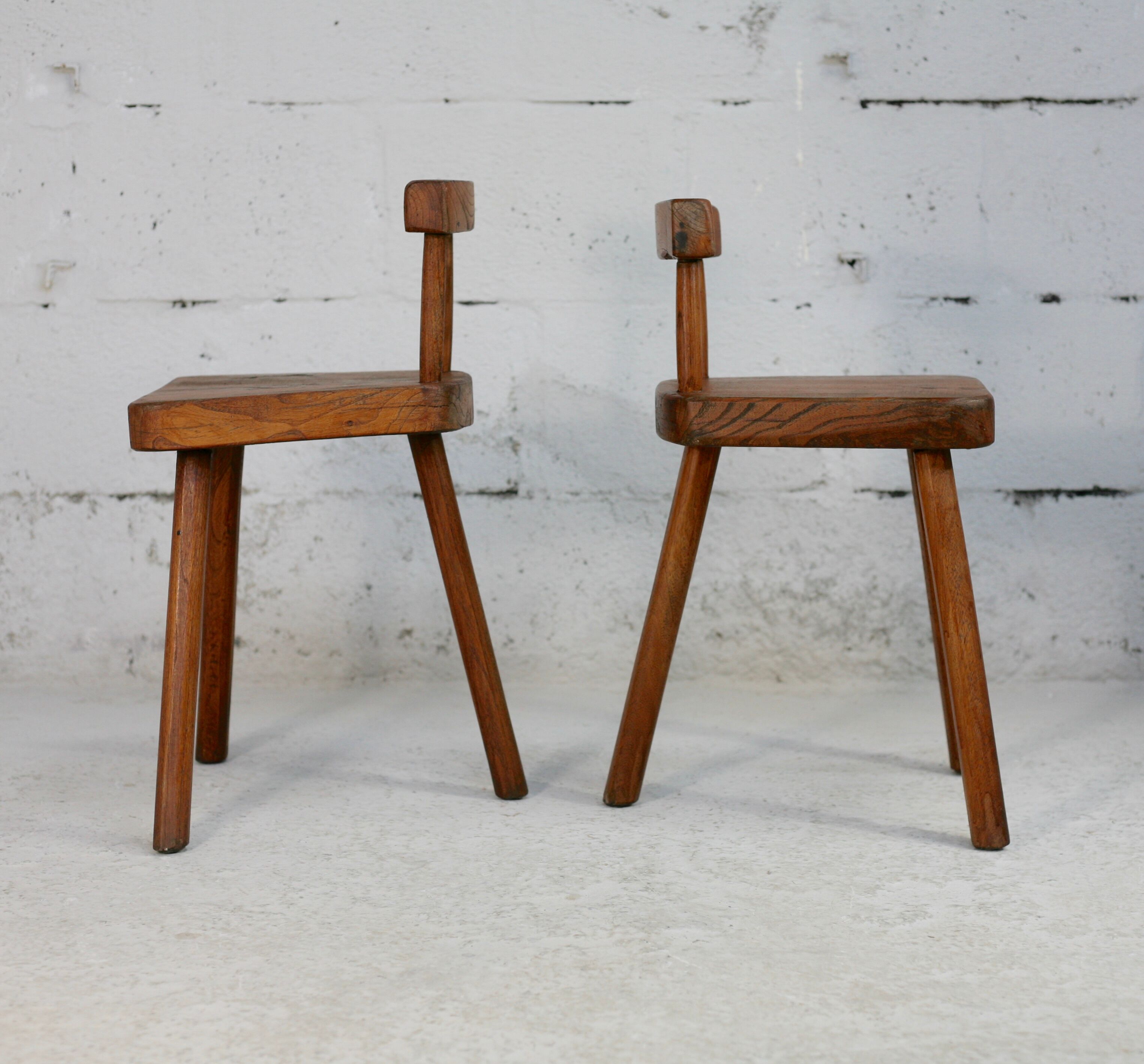 Pair of tripod stools with brutalist backrests, France, circa 1960