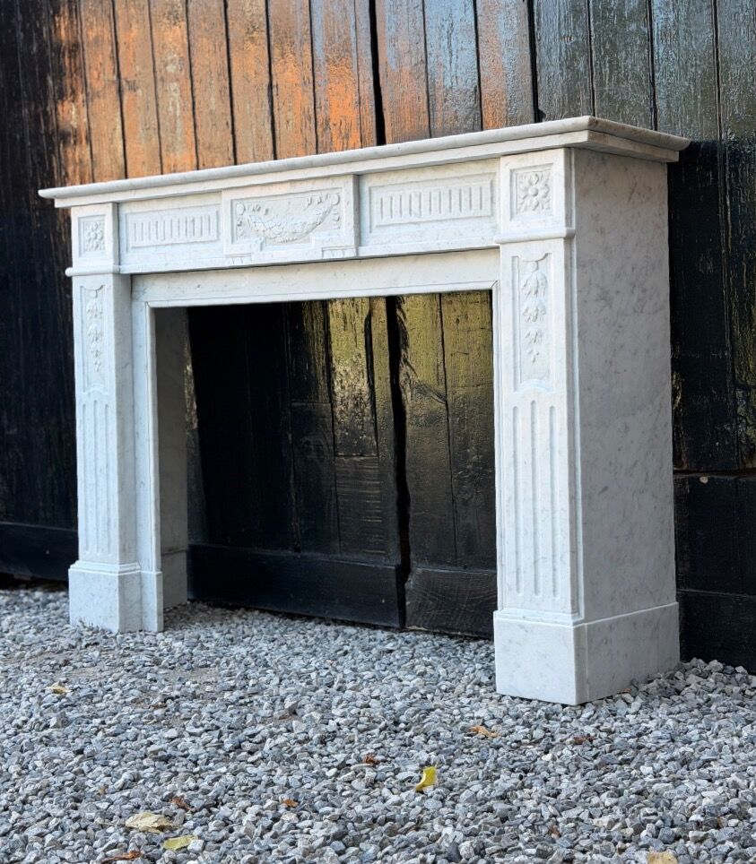 Louis XVI style fireplace in white Carrara marble, circa 1880.
