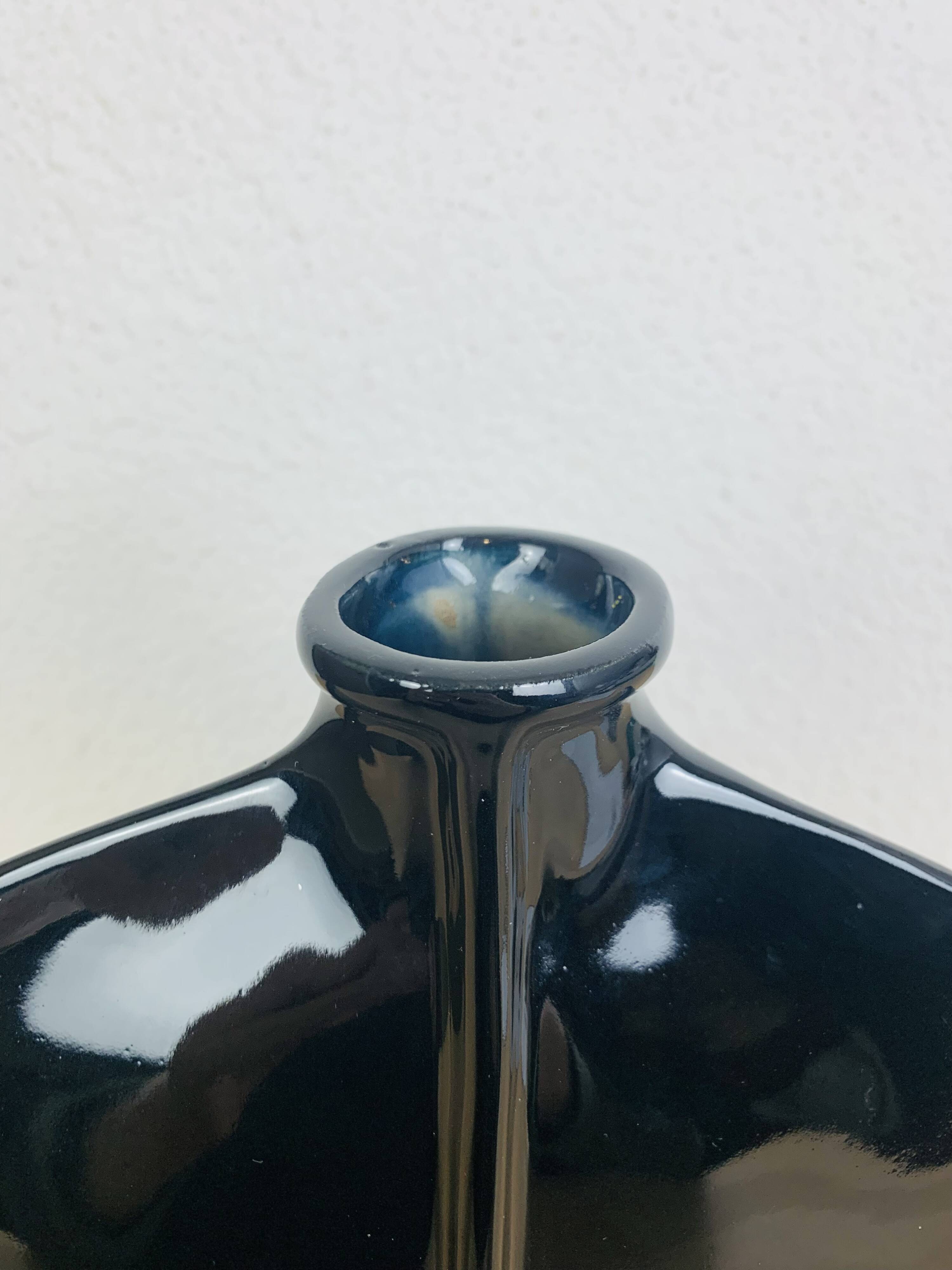 Vintage black ceramic lentil vase