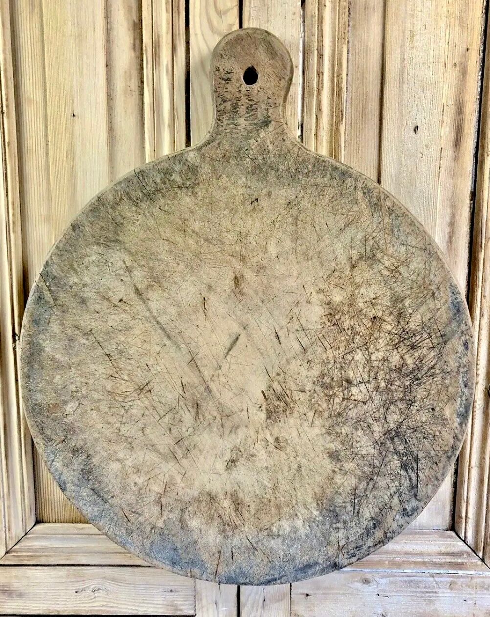 Old large round pizza cutting board