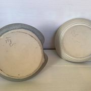 Pair of signed ceramic candlesticks