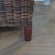 2 colonial-style armchairs in woven rattan and exotic wood