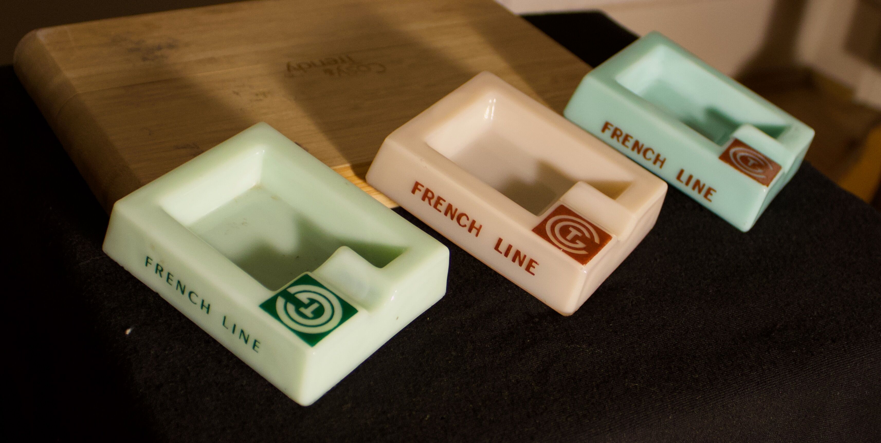 Three opalex ashtrays at the Logo of the Trans-Atlantic General Company - French Line - Model created by Jean Luce for the cruises of the liner Normandy and France