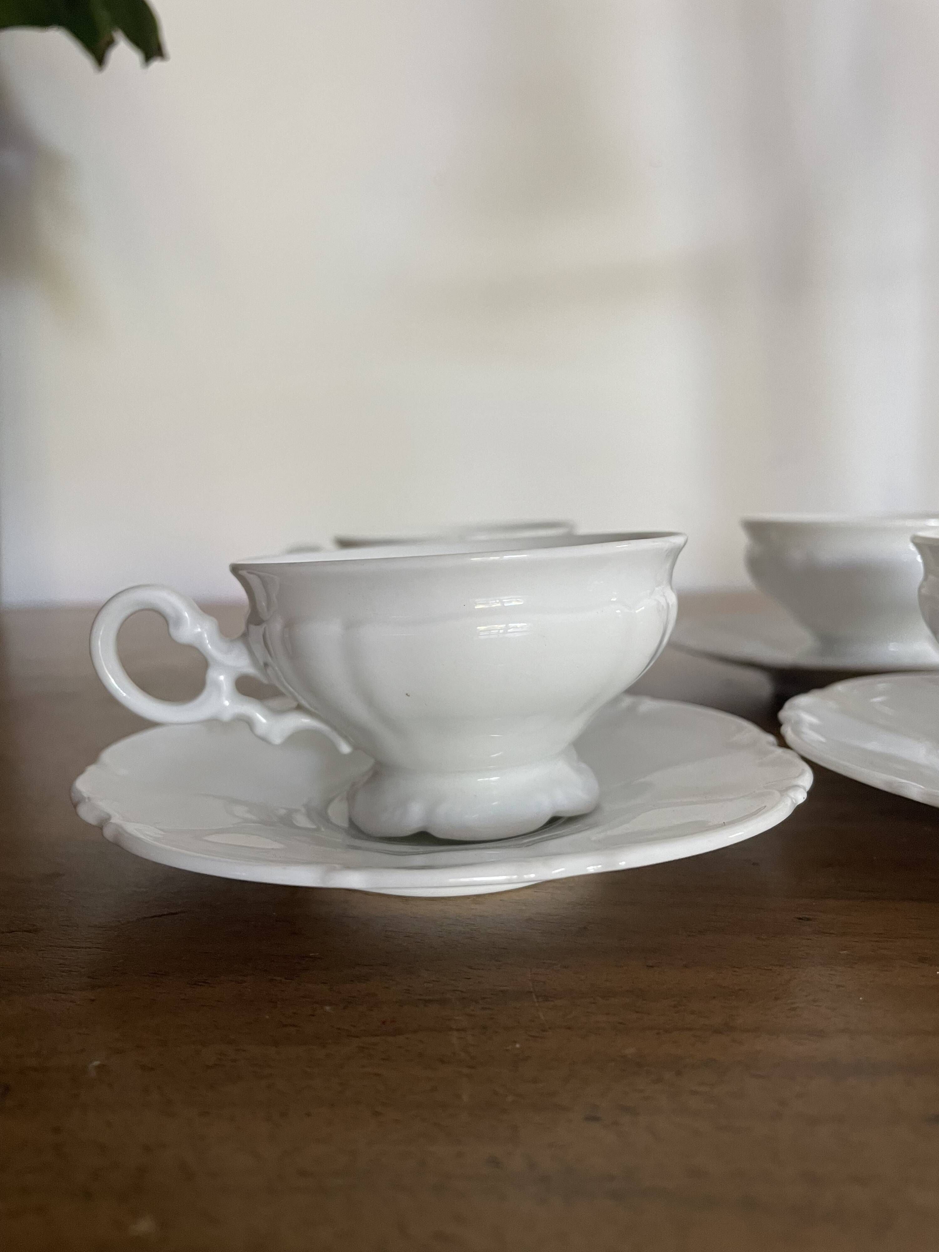 Set of 4 Hutschenreuther fine porcelain cups and saucers.