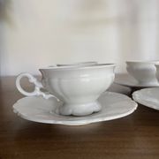 Set of 4 Hutschenreuther fine porcelain cups and saucers.