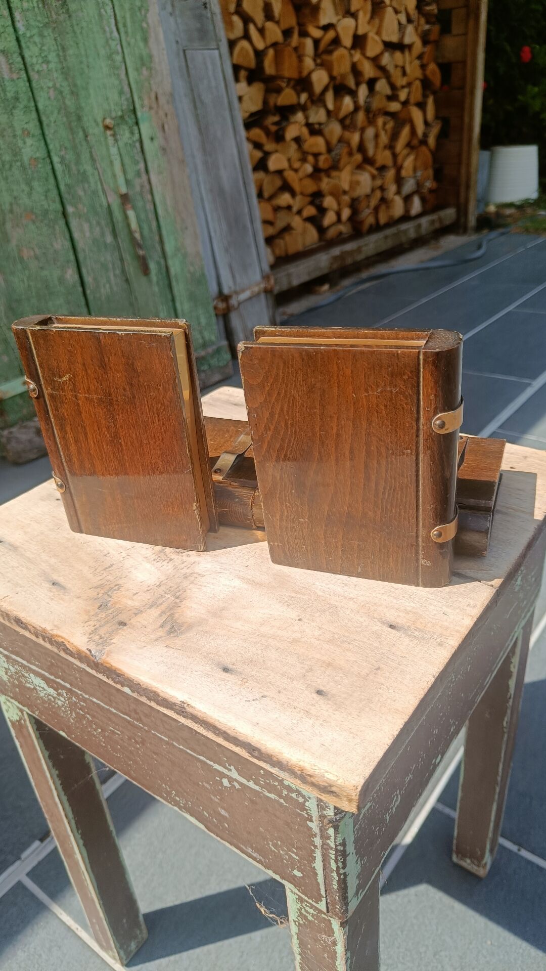 Wooden trompe-l'œil bookends with a book and box