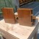Wooden trompe-l'œil bookends with a book and box