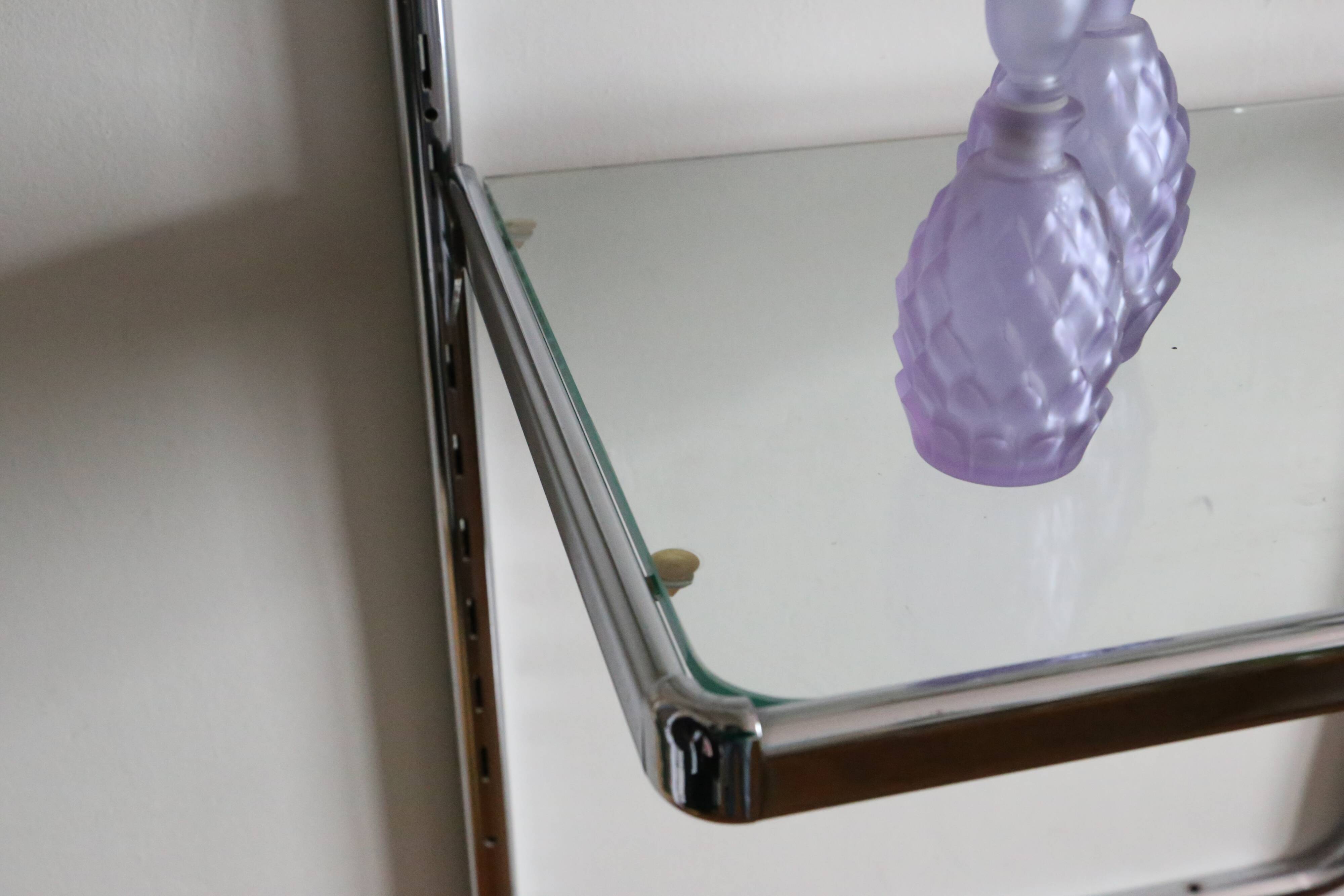 Chrome and glass wall shelf, circa 1960