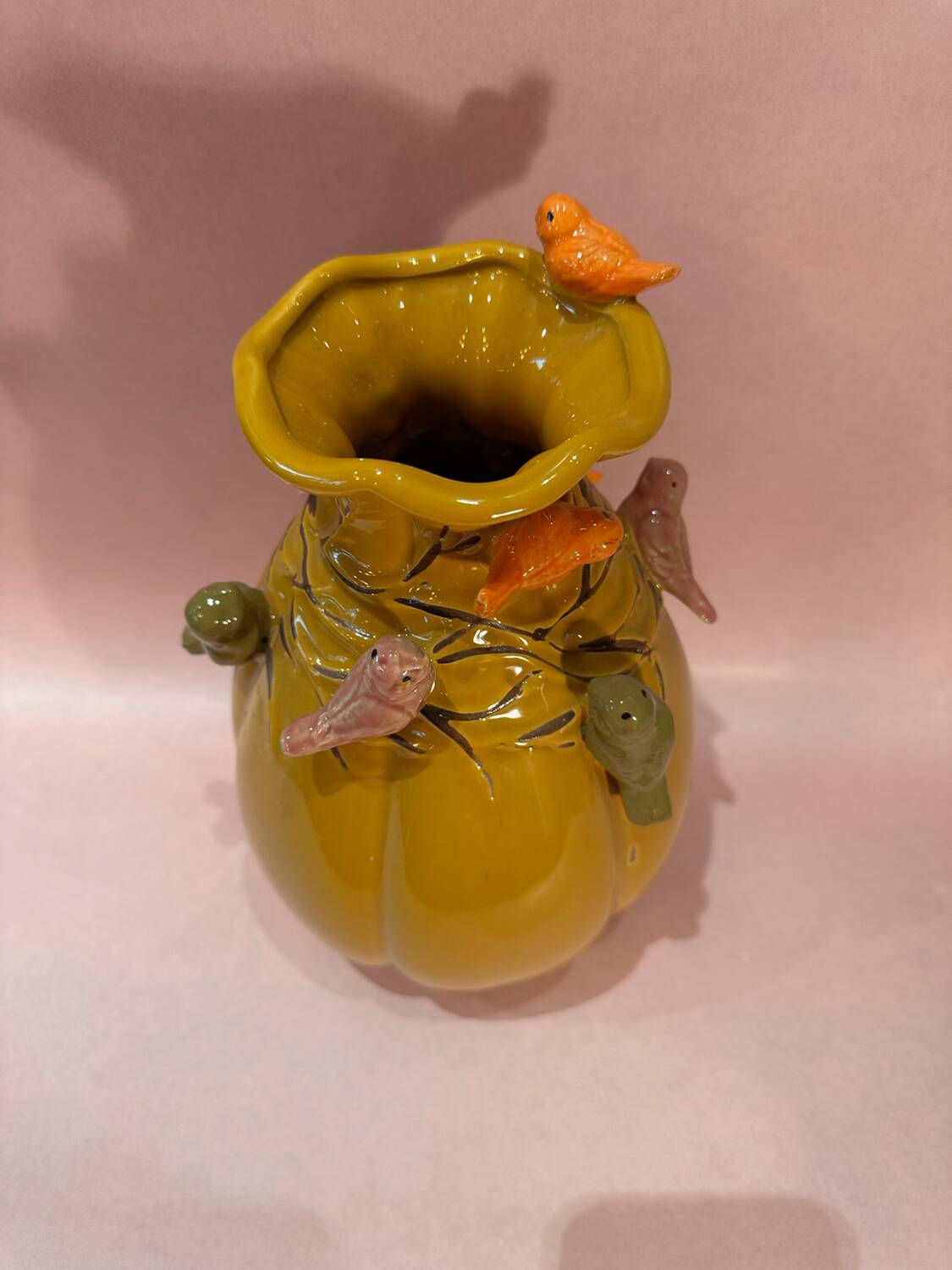 Yellow vase decorated with birds