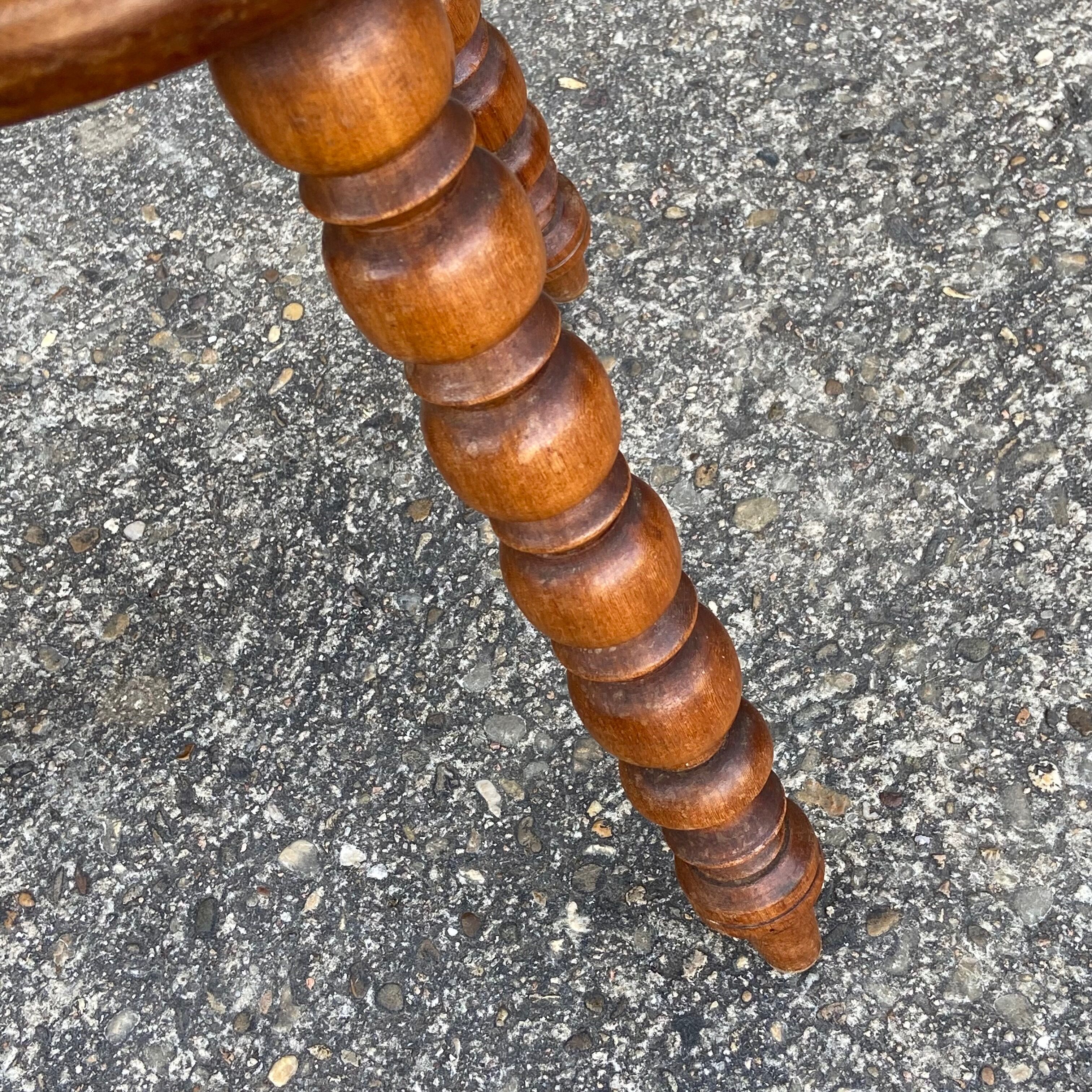Turned wooden tripod stool