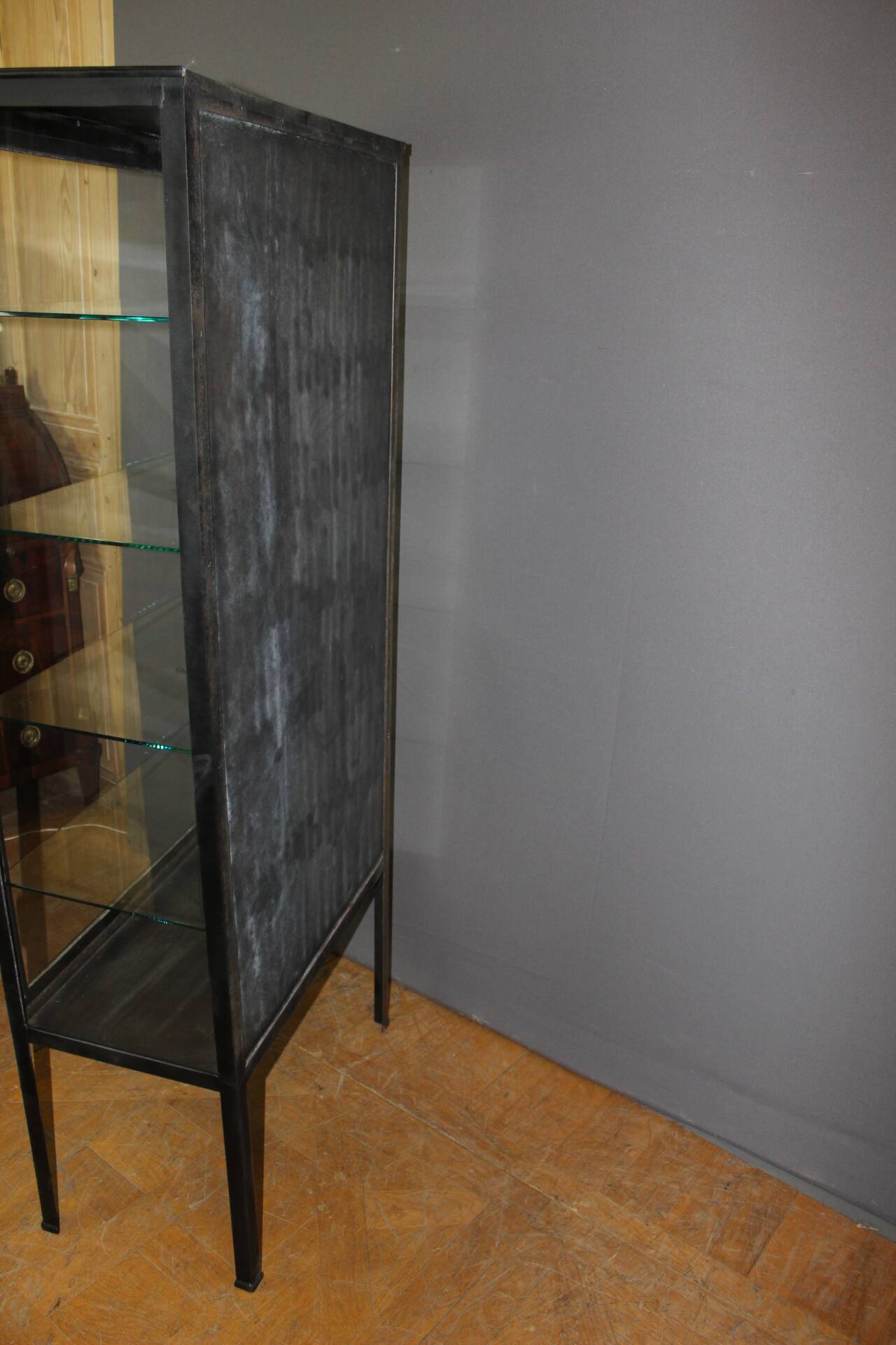 Iron display cabinet with black patina from around 1920