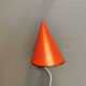 Danish red lacquered wall light with brass details. Estimated 1980s