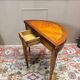 Half-moon game table in marquetry from the Louis XVI period, 18th century.