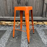 Orange metal workshop stool