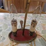 Old silver-plated bronze lamp, except for the arms which are not silver.