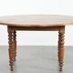 Antique English drop-leaf dining table made of walnut with elegant legs