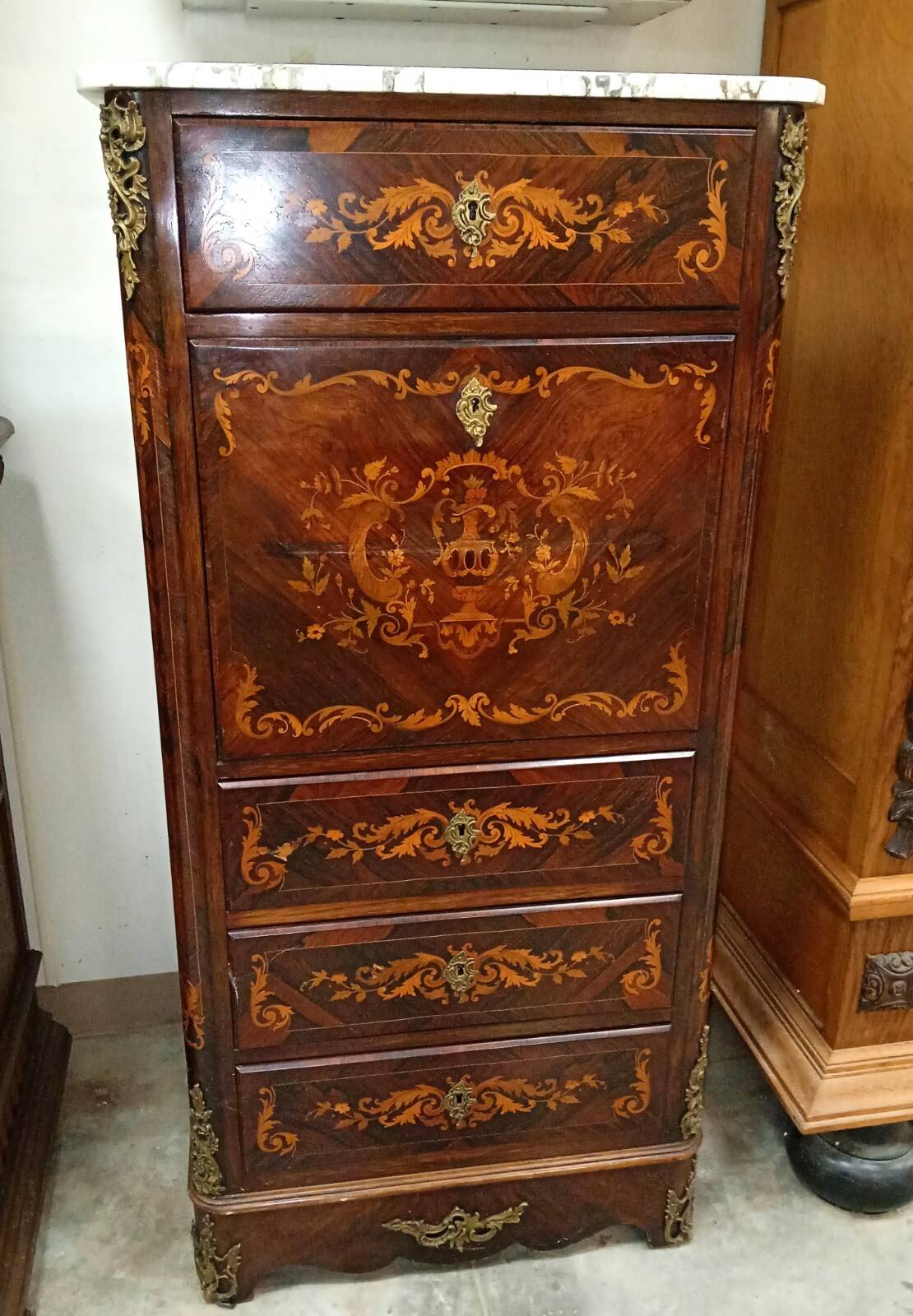 Secretary with a drop-leaf in precious marquetry wood in the Louis XV style.