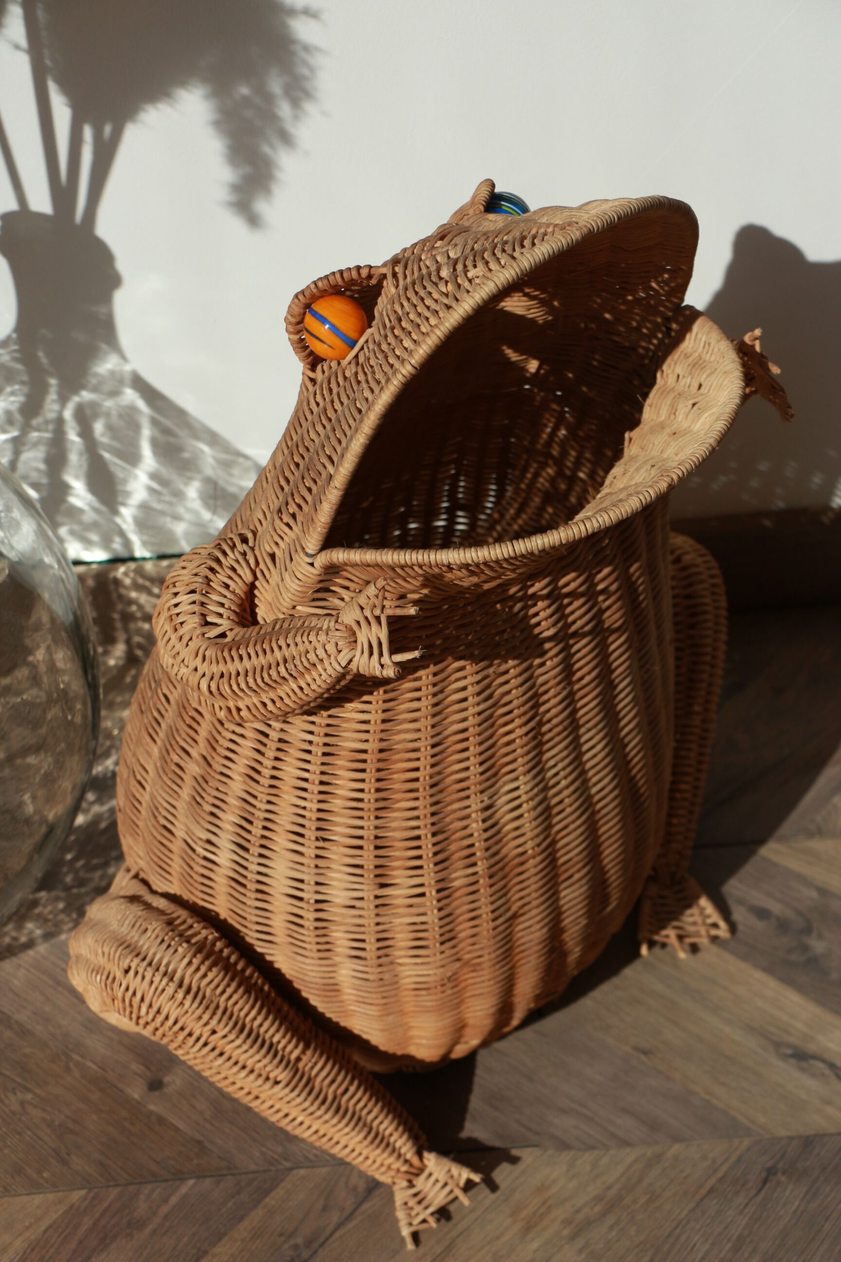 Wicker frog magazine rack by Olivier Cajan