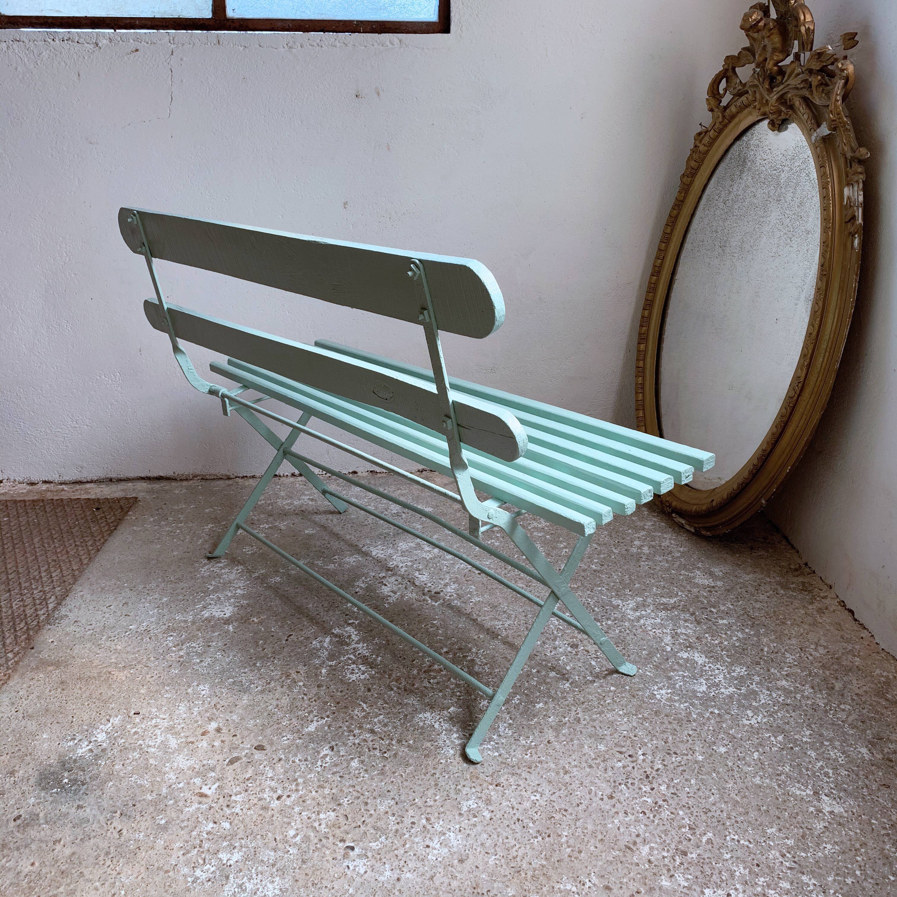 Former folding garden bench with wooden and metal slats