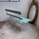 Former folding garden bench with wooden and metal slats