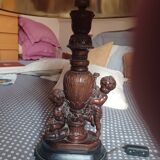 Table lamp on a piece of furniture cherub in very good condition