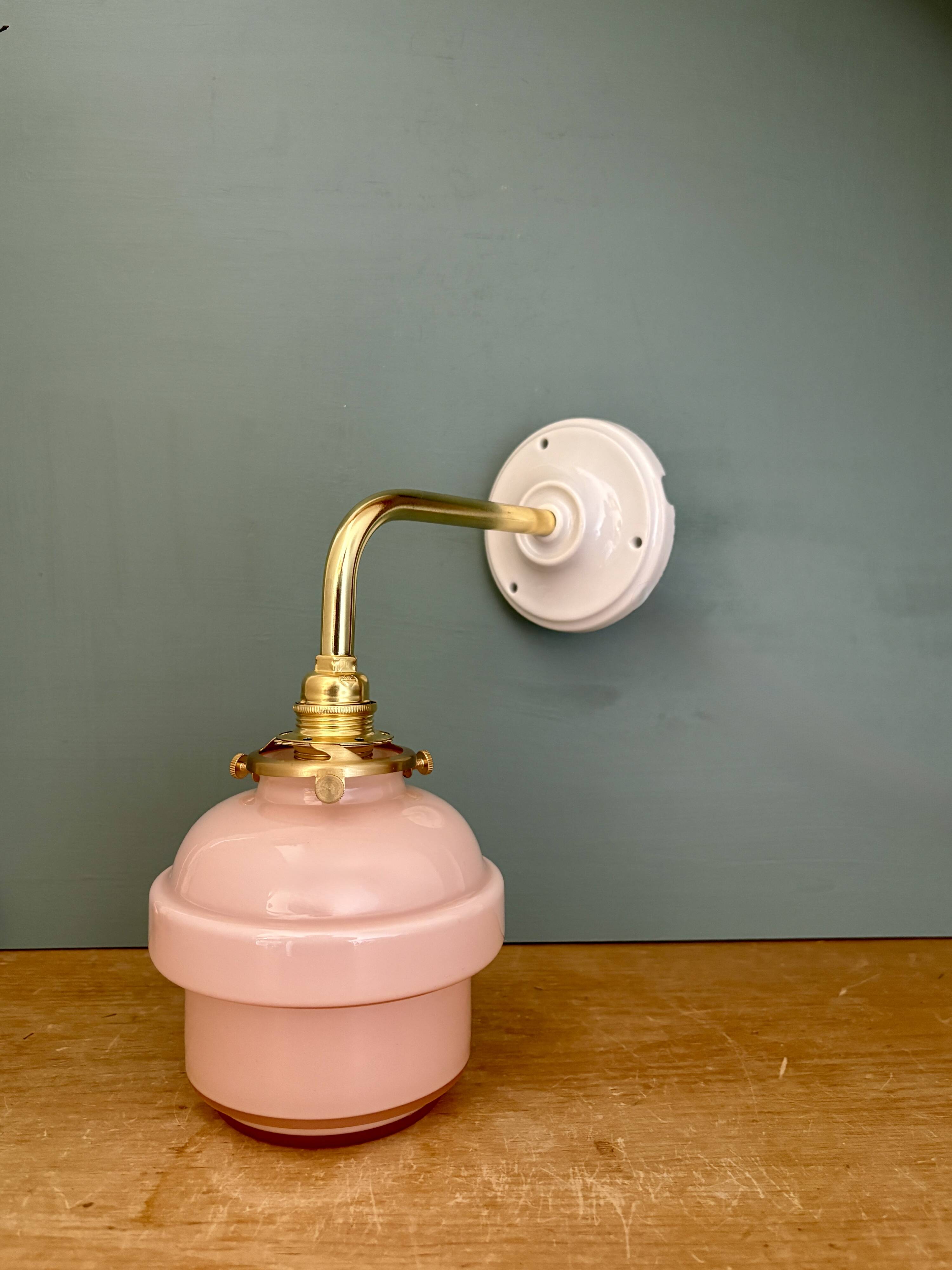 Vintage pink opaline globe wall light.
