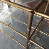 Console in gilded metal and glass