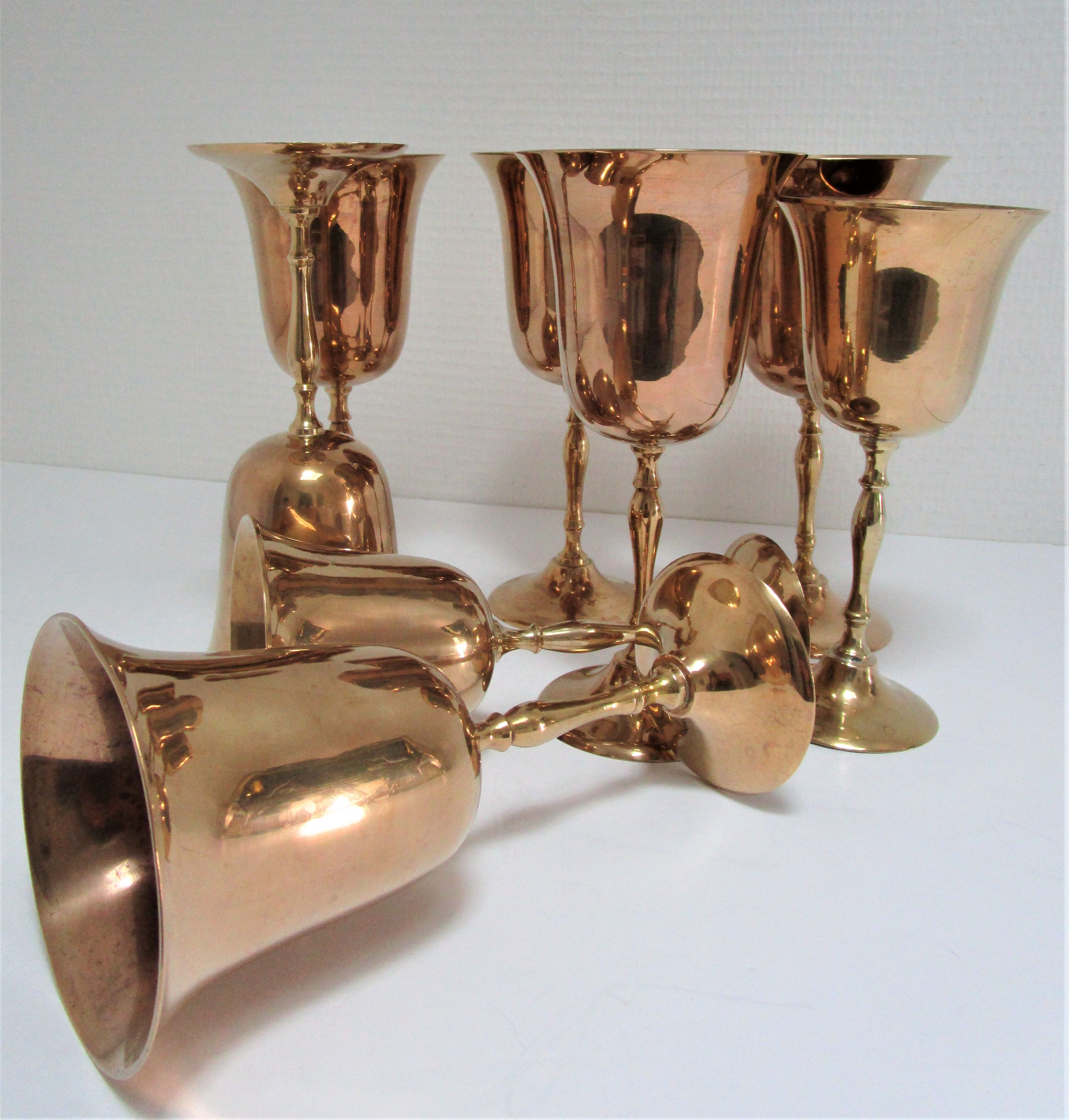 Set of eight vintage solid brass walking glasses