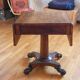 Drop-leaf table in rosewood
