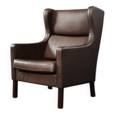 Brown leather wingback chair in mid-century modern Danish style, 1960s.