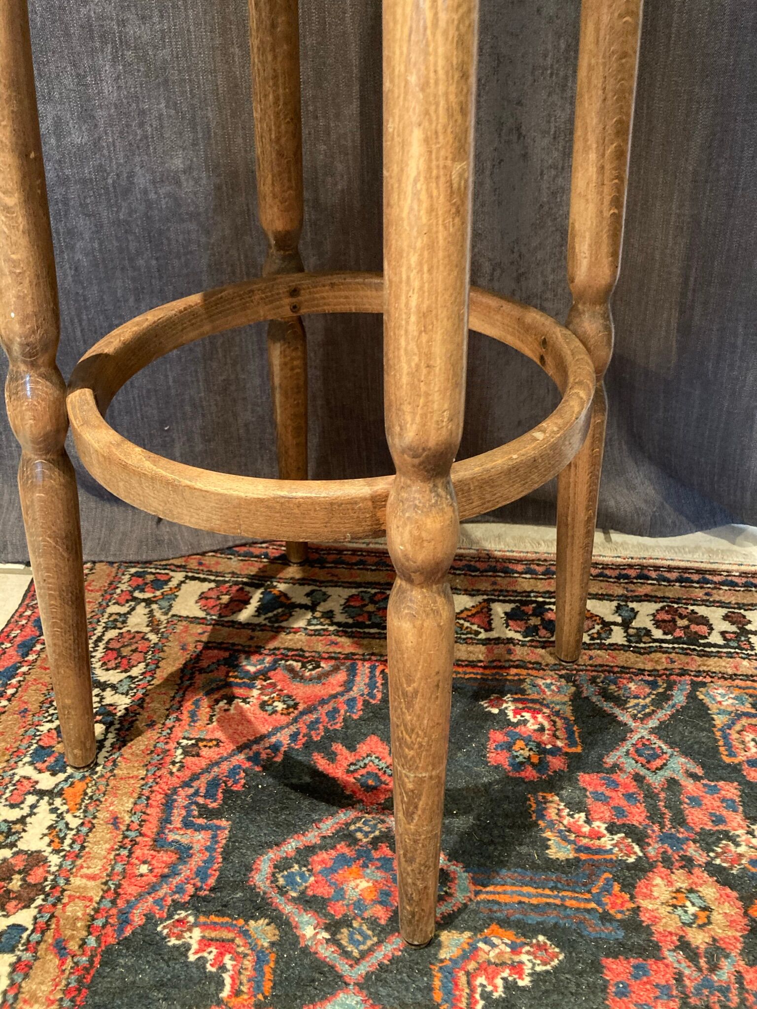 High curved wooden stool