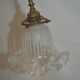 Brass wall sconce with a glass tulip