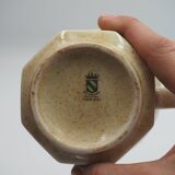 Speckled cup with flower pattern