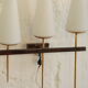 Old wall in brass and white opaline glass tulip
