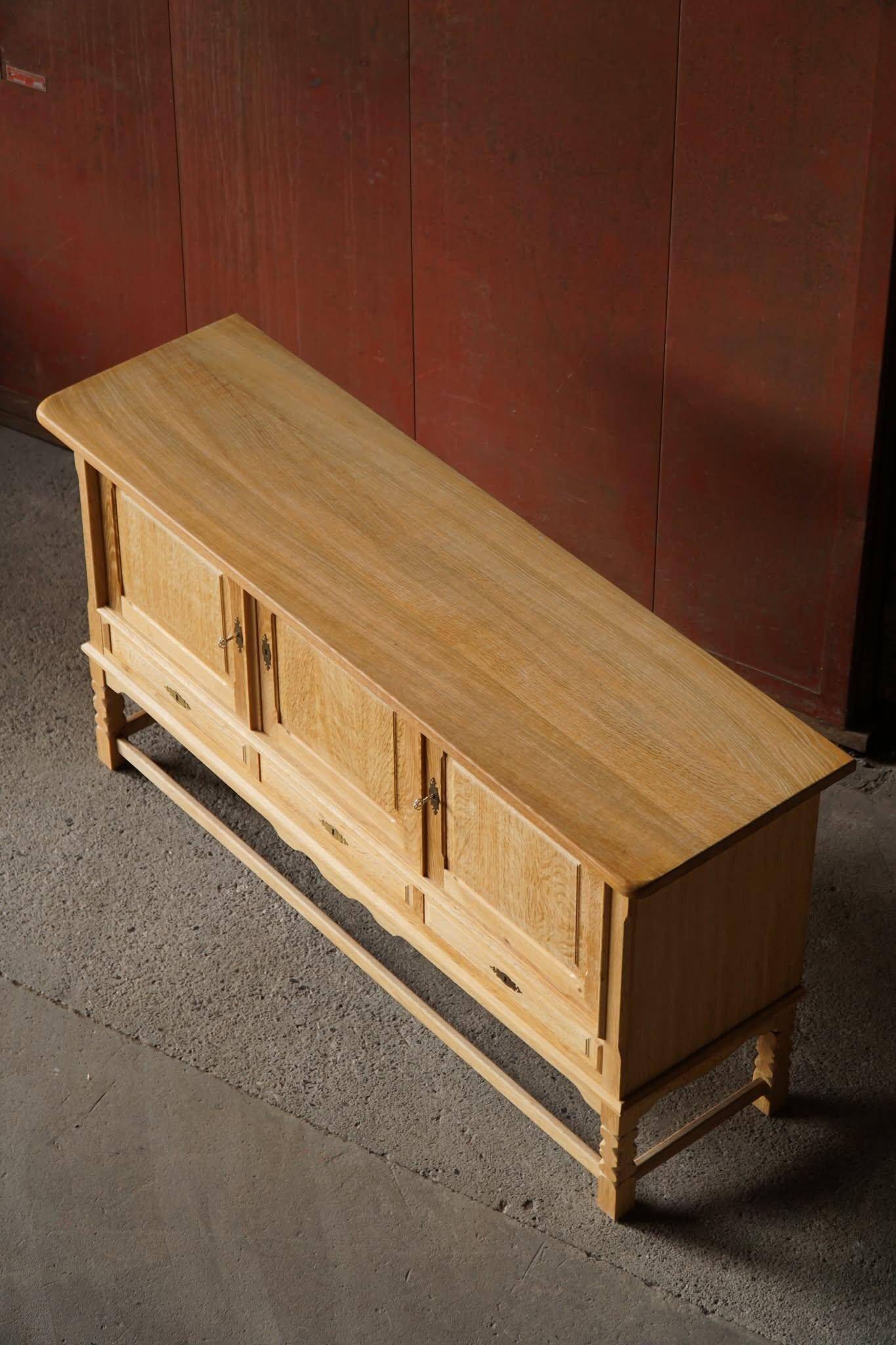 Brutalist Danish enfilade from the mid-century in oak by Henning Kjærnulf, 1960s.