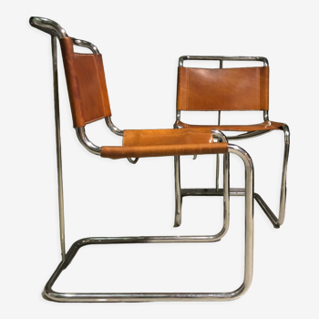 A pair of chromed tubular dining chairs 1980's