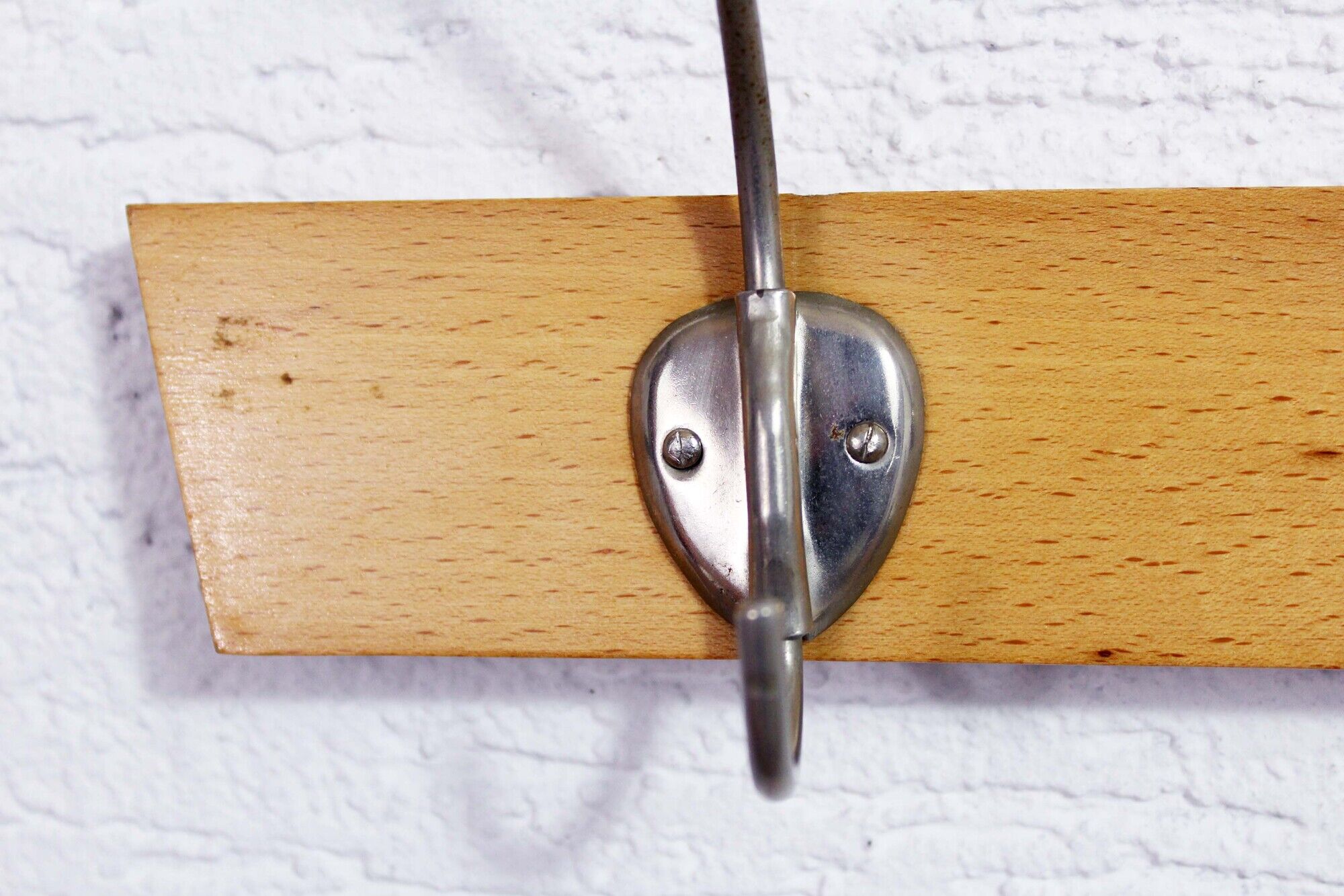 Peg wood and metal, wearing vintage coat