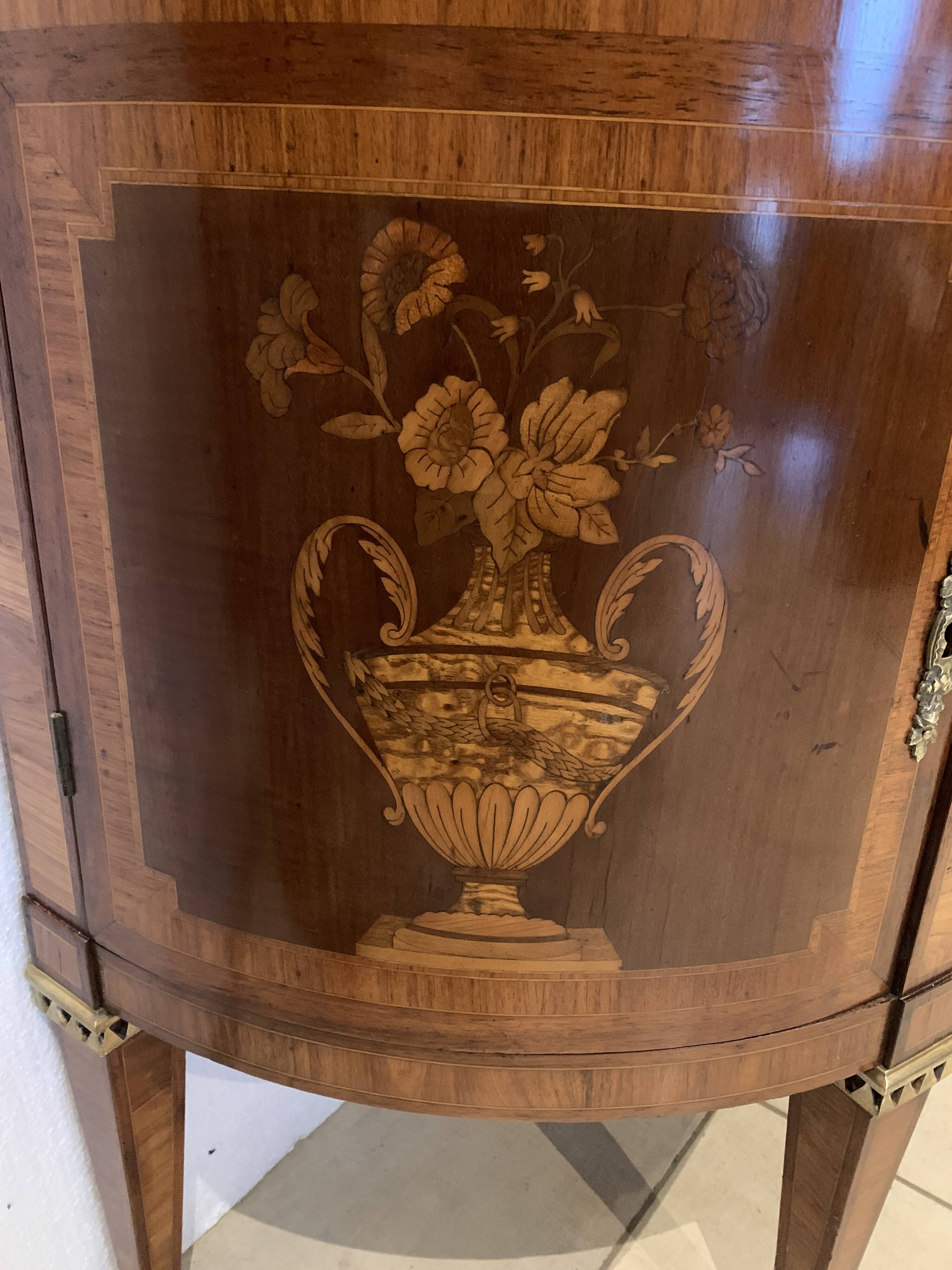 Louis XVI style half-moon chest of drawers in late nineteenth century marquetry