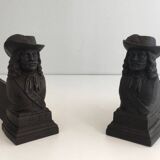 Pair of cast iron andirons in the likeness of a musketeer