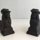 Pair of cast iron andirons in the likeness of a musketeer