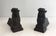 Pair of cast iron andirons in the likeness of a musketeer