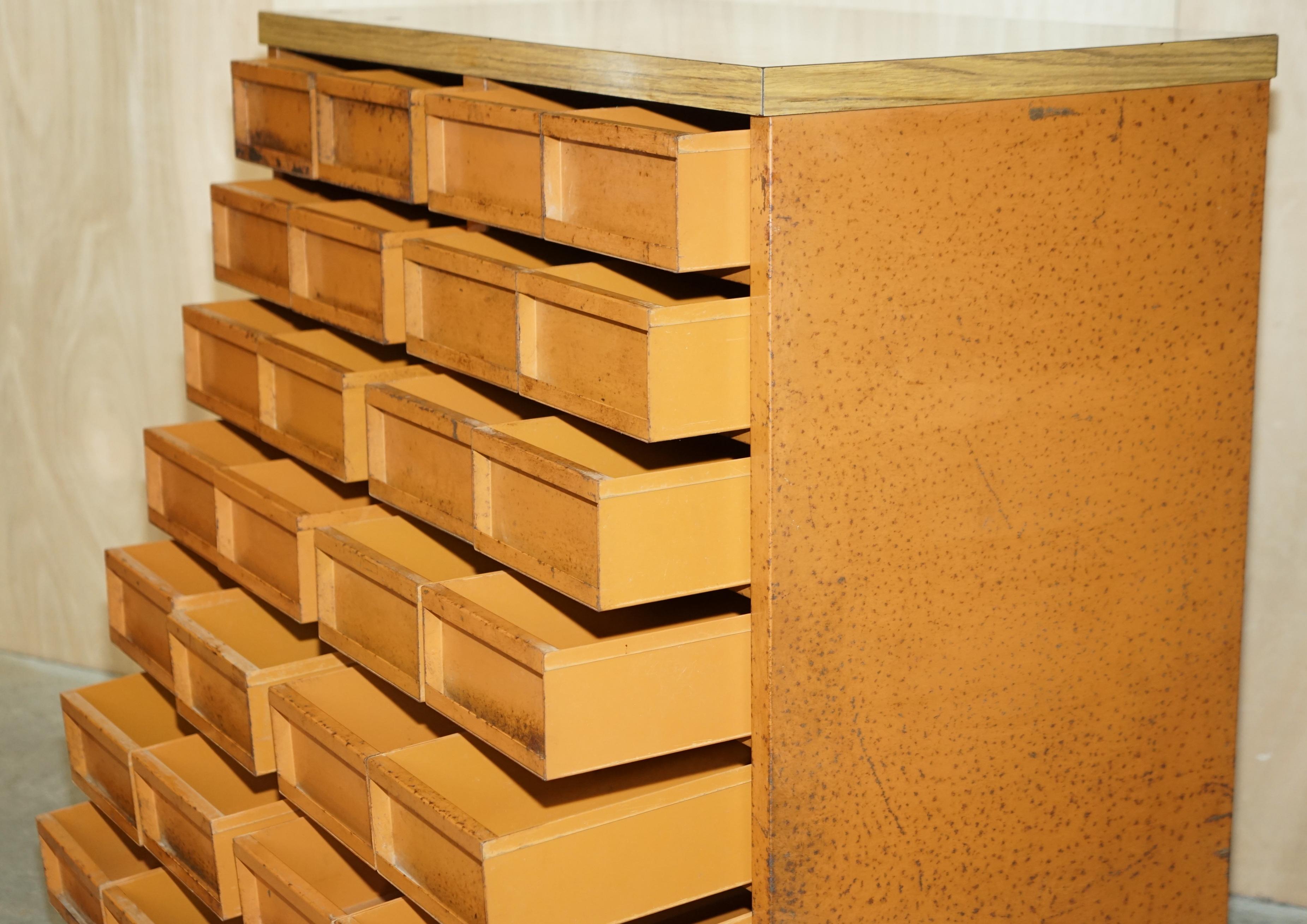 Industrial metal chest of drawers with 30 drawers.