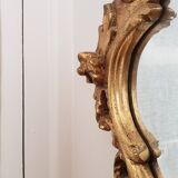 Beveled mirror and gilded wood