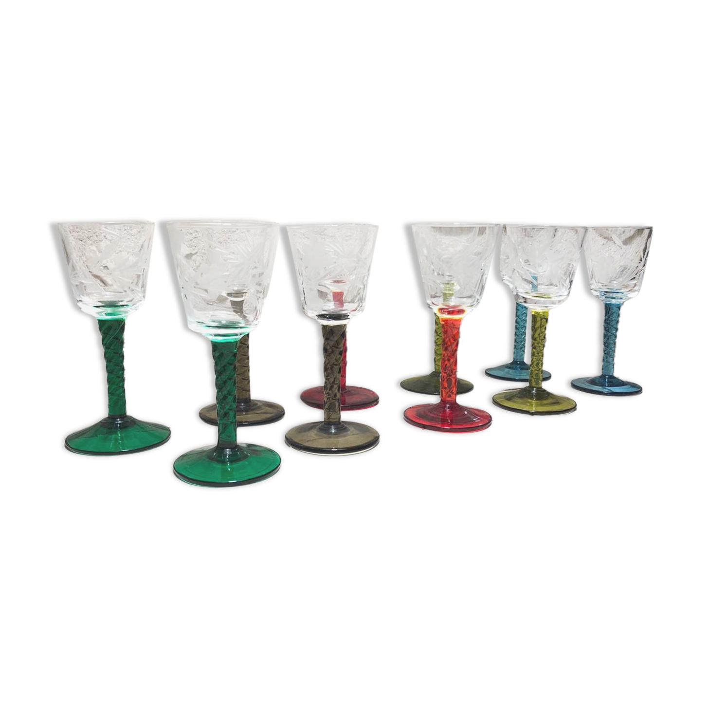 Antique and rare! Sold in a set of 12 colorful twisted stemmed glasses engraved with flowers and leaves