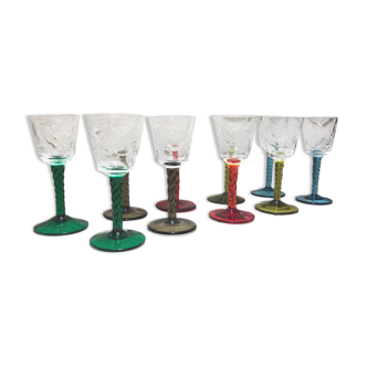 Antique and rare! Sold in a set of 12 colorful twisted stemmed glasses engraved with flowers and leaves