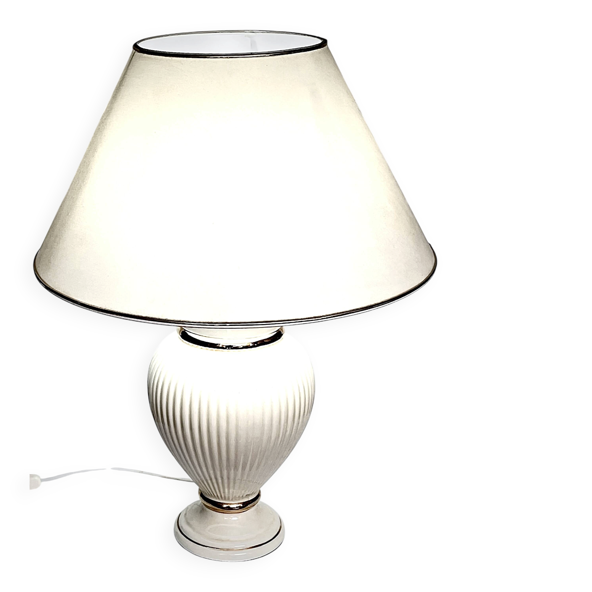 Vintage white ceramic table lamp, ribbed body and conical shade.