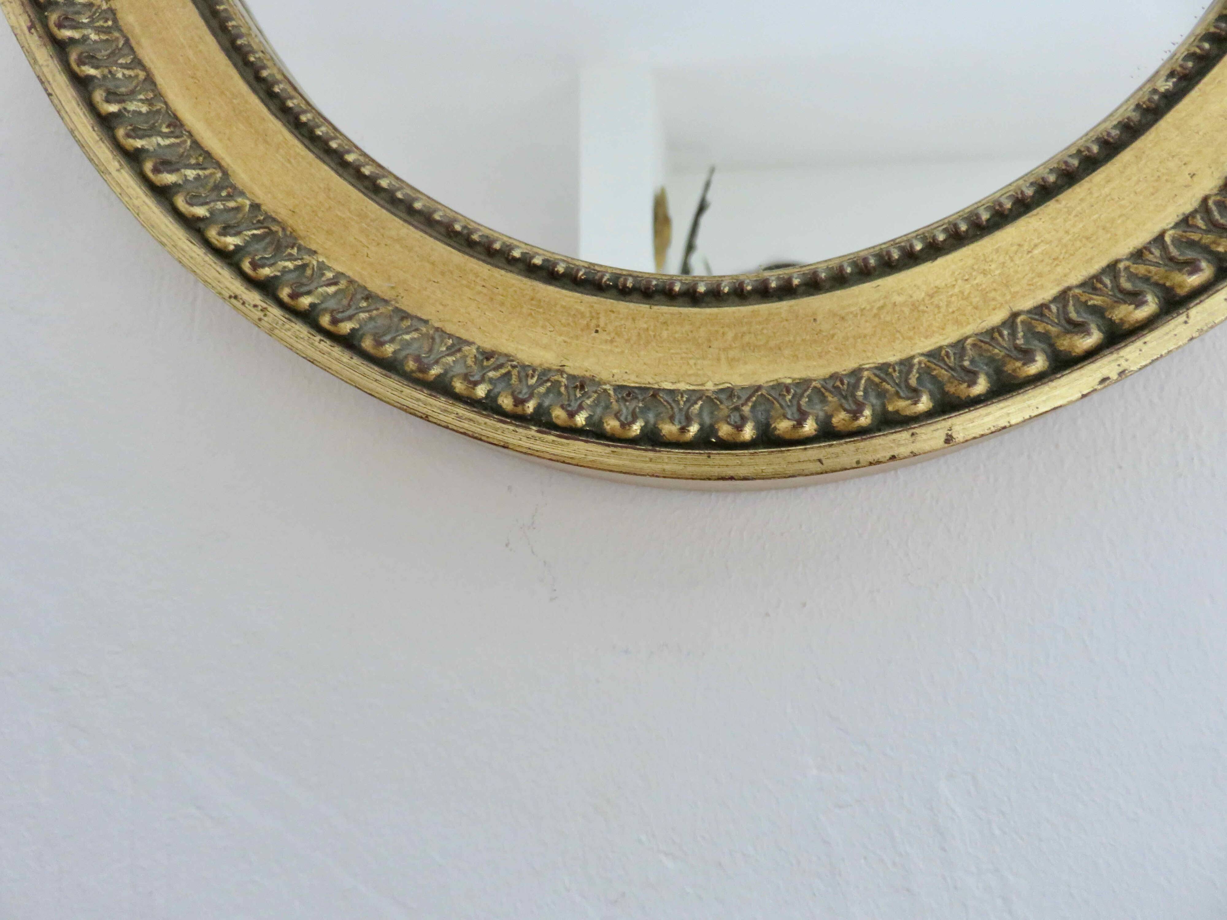 Louis Philippe oval gold wall mirror, 1950s